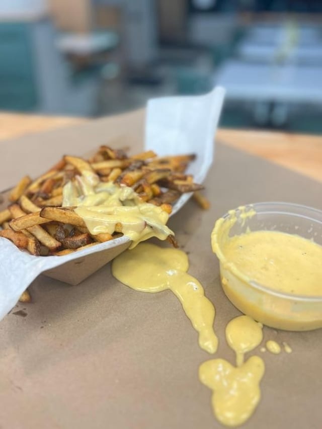 House Made Cheese Whiz Cheese Fries.